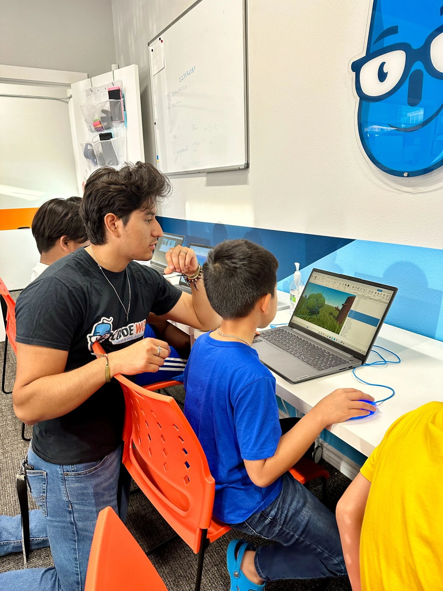 Teen working with AI tools in a Code Wiz class